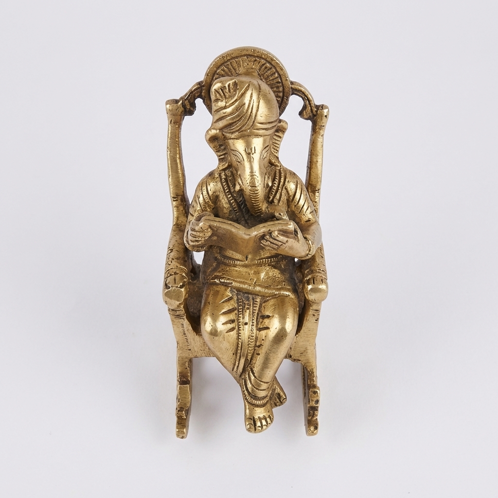 Divine Brass Ganesh Reading in Chair Figurine