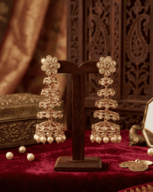 regal tiered temple jhumkas with floral studs and pristine pearl drops
