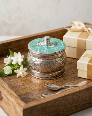 enchanting german silver kumkum box with meenakari cow motif