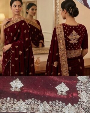 A beautiful Maroon Tissue Saree with Embroidery with intricate gold embroidery and stone work, displayed on a wooden hanger with a matching designer blouse piece