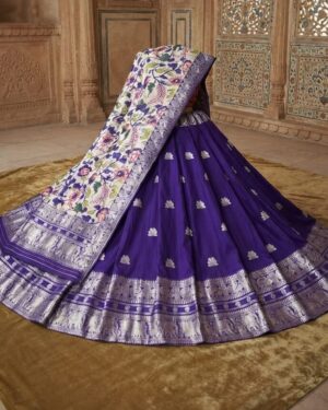 A Exquisite violer Banarasi silk lehenga paired with a floral patterned dupatta, displayed