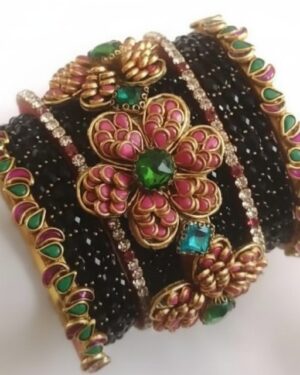 Exquisite Thread Bangles with 3D Kundan Artistry showcasing black textured thread work and vibrant pink and green floral stone motifs.