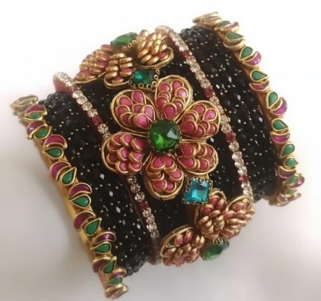 Exquisite Thread Bangles with 3D Kundan Artistry showcasing black textured thread work and vibrant pink and green floral stone motifs.